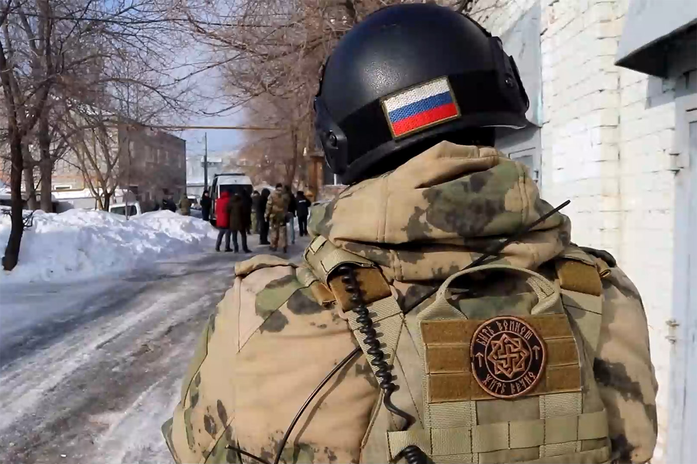 Screenshot from the FSB footage showing an officer’s uniform patch with a neo-nazi symbol.